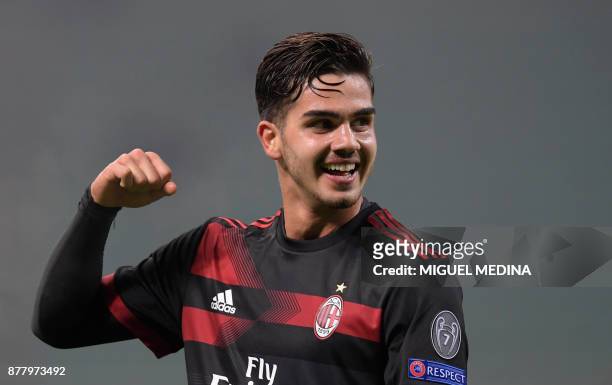 Milan's Portuguese forward Andre Silva celebrates after scoring during the UEFA Europa League group D football match between AC Milan and FK...