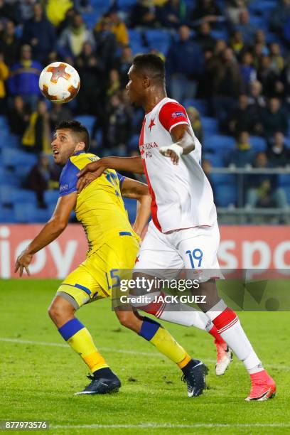 Maccabi's Israeli defender Dor Micha vies for the ball with Slavia's Ivorian defender Simon Deli during the Europa League Group A football match...