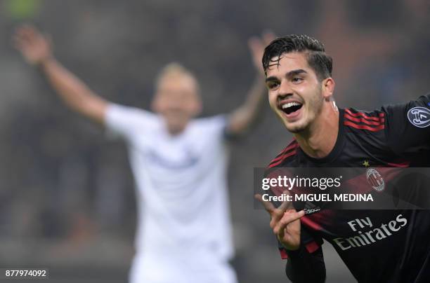 Milan's Portuguese forward Andre Silva celebrates after scoring during the UEFA Europa League group D football match between AC Milan and FK...