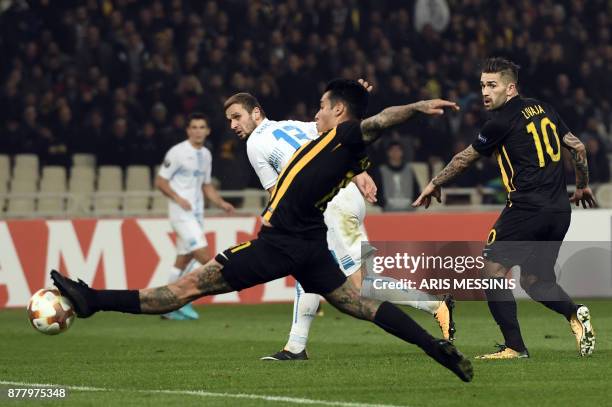 S Sergio Araujo scores a goal as Rijeka's Dario Zuparic and AEK's Marko Livaja look on during the UEFA Europa League Group D football match between...