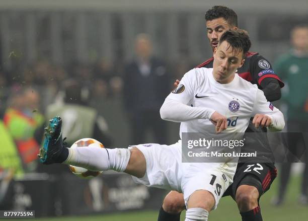 Dominik Prokop of Austria Wien is challenged by Mateo Musacchio of AC Milan during the UEFA Europa League group D match between AC Milan and Austria...