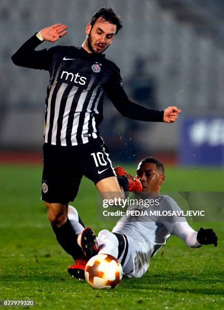 Partizan's Marko Jankovic fights for the ball with Guillaume Hoarau of Young Boys during the UEFA Europa League football match between Partizan...