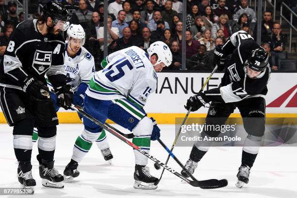 Derek Dorsett of the Vancouver Canucks battles for the puck against Tanner Pearson and Drew Doughty of the Los Angeles Kings during the game on...