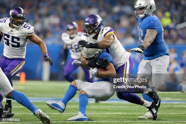 Detroit Lions wide receiver Golden Tate is tackled by Minnesota Vikings defensive end Everson Griffen during the second half of an NFL football game...