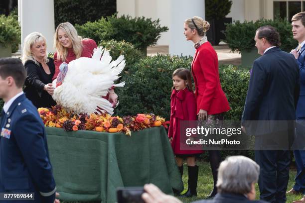 Tiffany Trump, her sister Ivanka Trump, right, and her daughter Arabella Kushner, look at Drumstick, after he was pardoned by President Donald Trump...