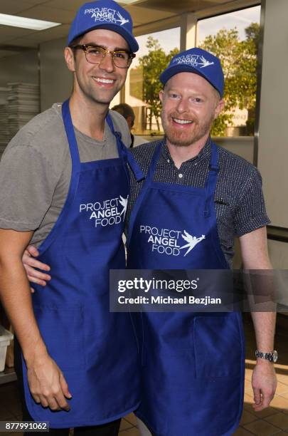 Justin Mikita and Jesse Tyler Ferguson volunteer for Thanksgiving Day at Project Angel Food on November 23, 2017 in Los Angeles, California.