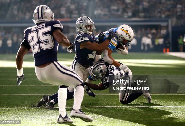 Byron Jones of the Dallas Cowboys and Jourdan Lewis of the Dallas Cowboys combine to tackle Austin Ekeler of the Los Angeles Chargers in the first...
