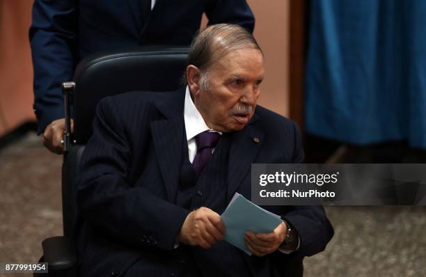 Algerian President Abdelaziz Bouteflika heads to vote at a polling station in Algiers on November 23, 2017 as Algeria goes to the polls for local...