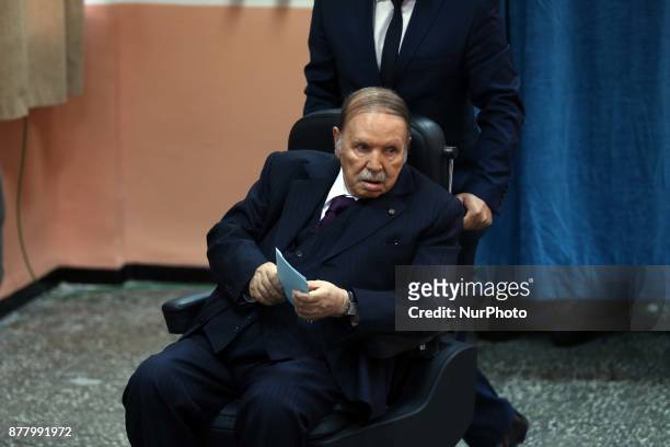 Algerian President Abdelaziz Bouteflika heads to vote at a polling station in Algiers on November 23, 2017 as Algeria goes to the polls for local...