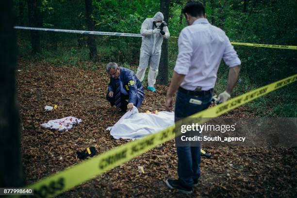 fbi working - murder victim stock pictures, royalty-free photos & images