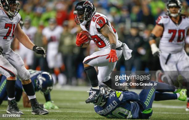 Running back Terron Ward of the Atlanta Falcons rushes against free safety Bradley McDougald of the Seattle Seahawks at CenturyLink Field on November...