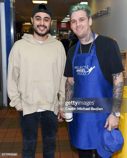 Jason Sanchez and Aaron Carter volunteer for Thanksgiving Day at Project Angel Food on November 23, 2017 in Los Angeles, California.