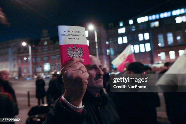 Man holding Polish constitution is seen in Gdansk, Poland on 23 November 2017 People protest in front of Gdansk Regional Court against the new law ,...