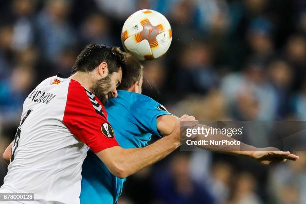 Artem Dzyuba of FC Zenit Saint Petersburg and Boban Grncharov of FK Vardar vie for a header during the UEFA Europa League Group L match between FC...