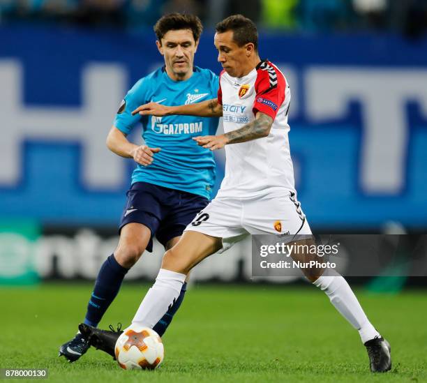 Yuri Zhirkov of FC Zenit Saint Petersburg and Juan Felipe Ribeiro of FK Vardar vie for the ball during the UEFA Europa League Group L match between...