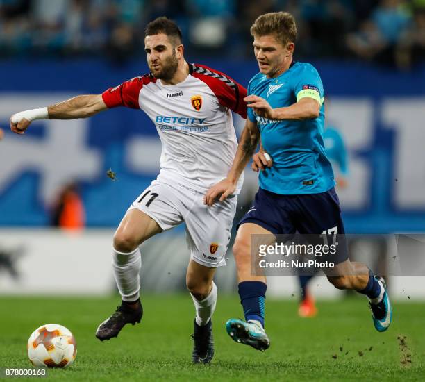 Oleg Shatov of FC Zenit Saint Petersburg and Tigran Barseghyan of FK Vardar vie for the ball during the UEFA Europa League Group L match between FC...