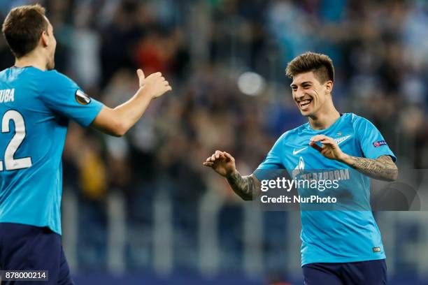 Emiliano Rigoni of FC Zenit Saint Petersburg celebrates his goal with Artem Dzyuba during the UEFA Europa League Group L match between FC Zenit St....