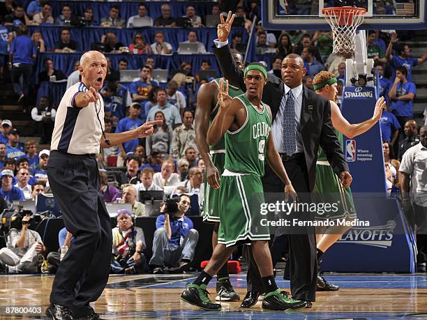 Referee Dick Bavetta makes a call as Rajon Rondo and head coach Doc Rivers of the Boston Celtics react during the game against the Orlando Magic in...