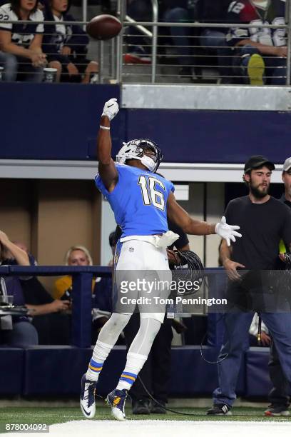 Tyrell Williams of the Los Angeles Chargers throws the footbal in the air after a touchdown in the third quarter against the Dallas Cowboys at AT&T...