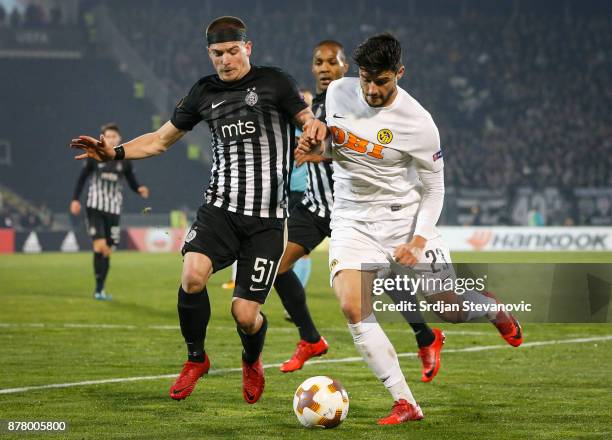 Ognjen Ozegovic of Partizan competes for the ball against Loris Benito of Young Boys during the UEFA Europa League group B match between Partizan and...