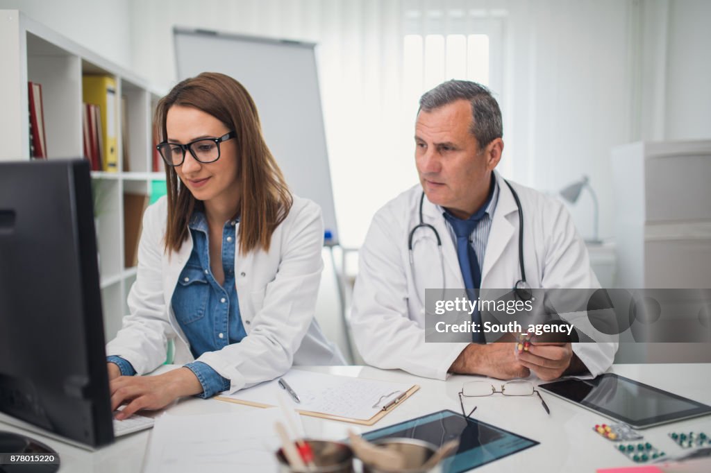 Doctor Using A Computer Doctors Using Computer In The Office High-Res Stock Photo - Getty Images