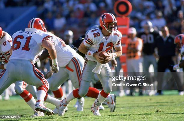 Chris Miller of the Atlanta Falcons drops back to pass against the Los Angeles Raiders at the Coliseum circa 1988 in Los Angeles,California on...