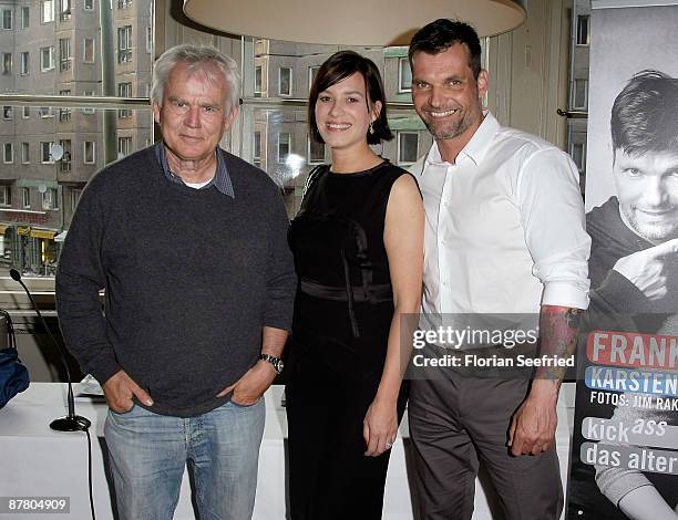 Photographer Jim Rakete and actress Franka Potente and fitness trainer Karsten Schellenberg attend the book presentation of 'Kick Ass' by Franka...