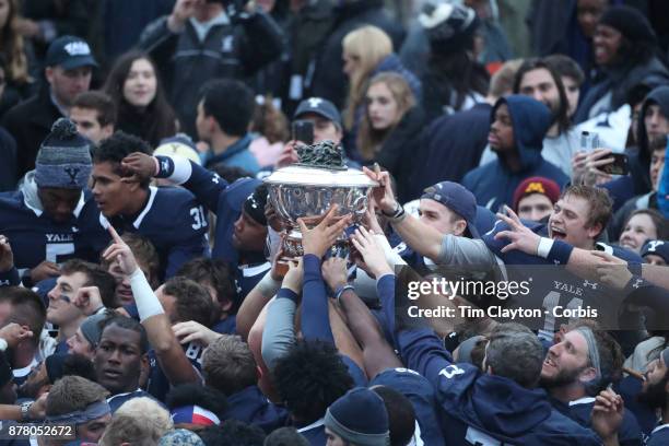 The Yale team with the trophy after the Yale V Harvard, Ivy League Football match at the Yale Bowl. Yale won the game 24-3 to win their first...