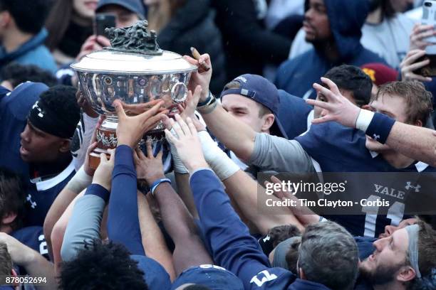 The Yale team with the trophy after the Yale V Harvard, Ivy League Football match at the Yale Bowl. Yale won the game 24-3 to win their first...