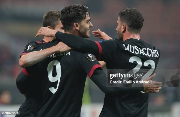 Andre Silva of AC Milan celebrates his first goal with his team-mate Mateo Pablo Musacchio during the UEFA Europa League group D match between AC...