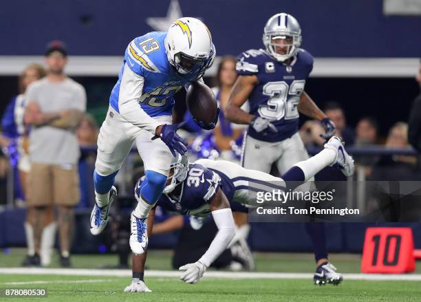 Keenan Allen of the Los Angeles Chargers breaks tackle by Anthony Brown of the Dallas Cowboys on a touchdown run in the fourth quarter at AT&T...