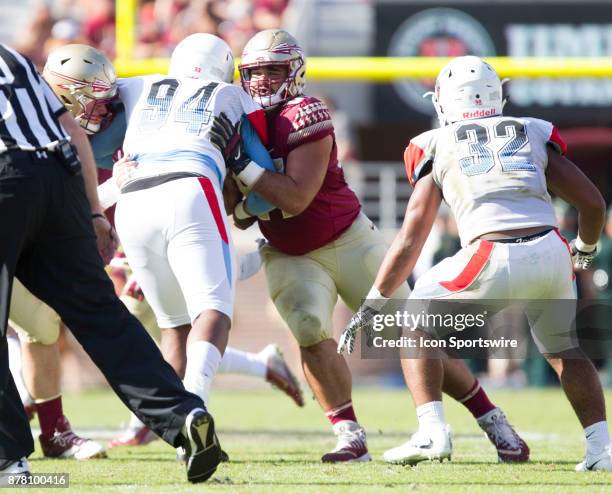Florida State Seminoles offensive lineman Corey Martinez blocks during the game between the Delaware State Hornets and the Florida State Seminoles at...