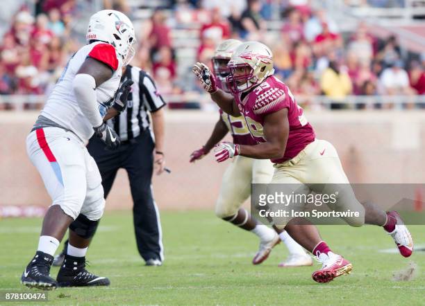 Florida State Seminoles defensive end Claudio Williams rushes during the game between the Delaware State Hornets and the Florida State Seminoles at...