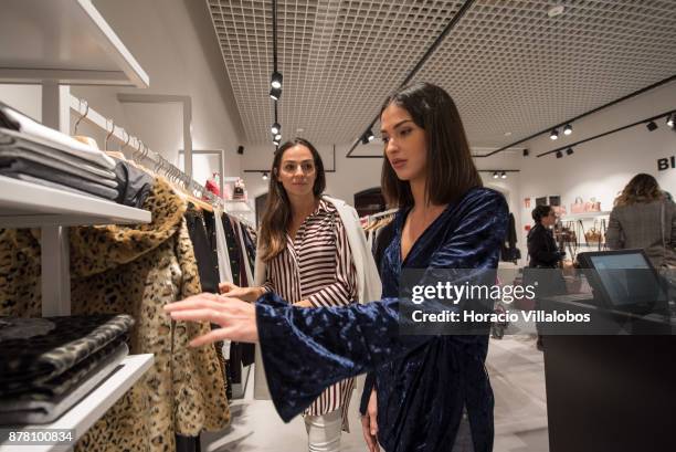 Portuguese blogger Vanessa Martins actress Sara Salgado check clothes at one of the stores during the Designer Outlet Algarve Grand Opening on...