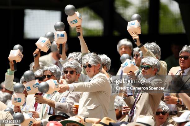 Fans dressed as the late Richie Benaud enjoy the atmsophere during day two of the First Test Match of the 2017/18 Ashes Series between Australia and...