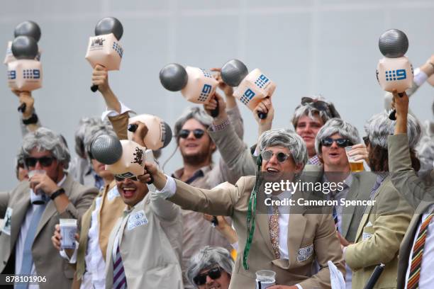 Fans dressed as the late Richie Benaud enjoy the atmsophere during day two of the First Test Match of the 2017/18 Ashes Series between Australia and...