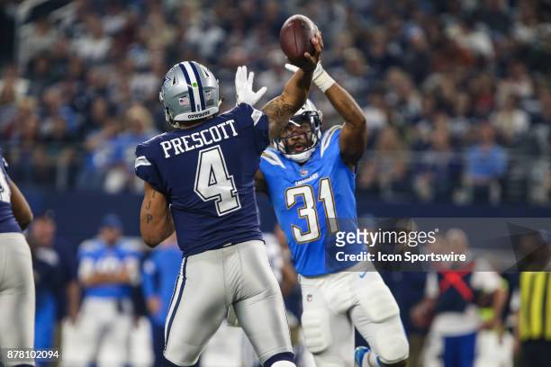 Dallas Cowboys quarterback Dak Prescott looks downfield for an open receiver with Los Angeles Chargers safety Adrian Phillips in his face during the...