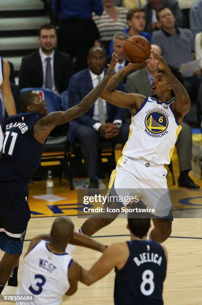 Golden State Warriors guard Nick Young puts up a shot against Jamal Crawford during an NBA game against the Minnesota Timberwolves on November 08,...