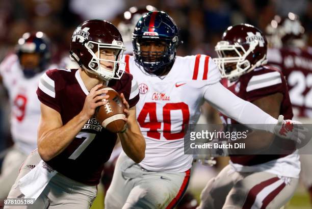 Nick Fitzgerald of the Mississippi State Bulldogs rolls out to pass during the first half of an NCAA football game against the Mississippi Rebels at...