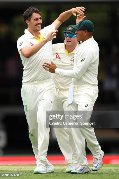 Pat Cummins of Australia celebrates dismissing Jonny Bairstow of England during day two of the First Test Match of the 2017/18 Ashes Series between...