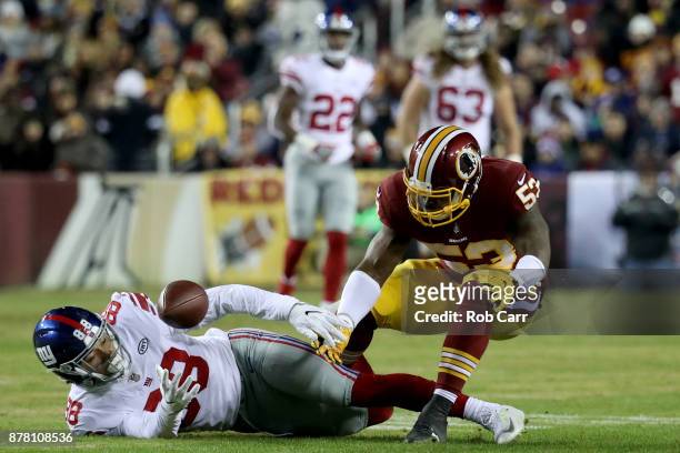 Tight end Evan Engram of the New York Giants drops a pass in front of inside linebacker Zach Brown of the Washington Redskins in the first quarter at...