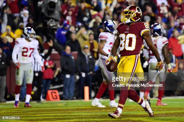 Wide receiver Jamison Crowder of the Washington Redskins celebrates after scoring a touchdown in the third quarter against the New York Giants at...