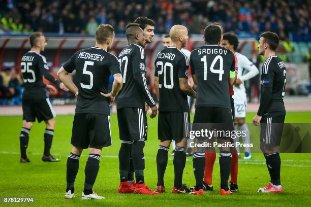 Referee Manuel De Sousa at rear center talks to Qarabag's Richard, who questions why Qarabag's Rashad Ferhad Sadygov was shown a red card for a foul...