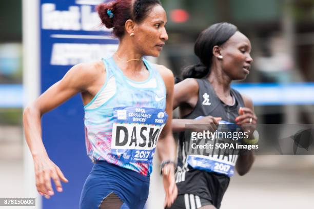 Runners coming off the Madison Avenue Bridge into Manhattan just before mile 21 of the New York City Marathon. Pictured are Mamitu Daska and Mary...