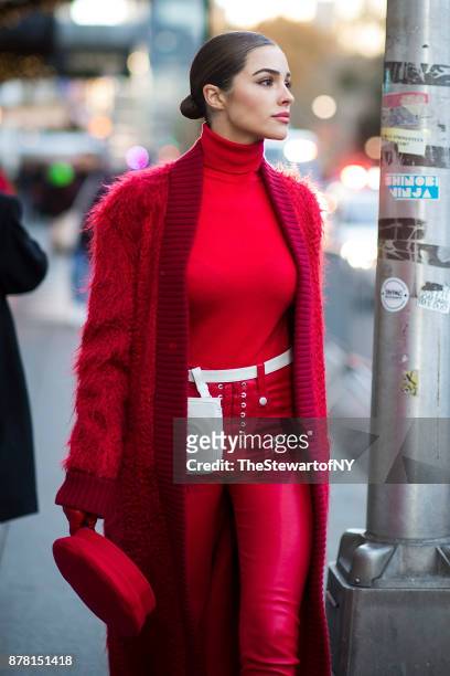 Olivia Culpo is seen wearing Max Mara with Jimmy Choo shoes and a Chanel belt bag in Midtown on November 23, 2017 in New York City.