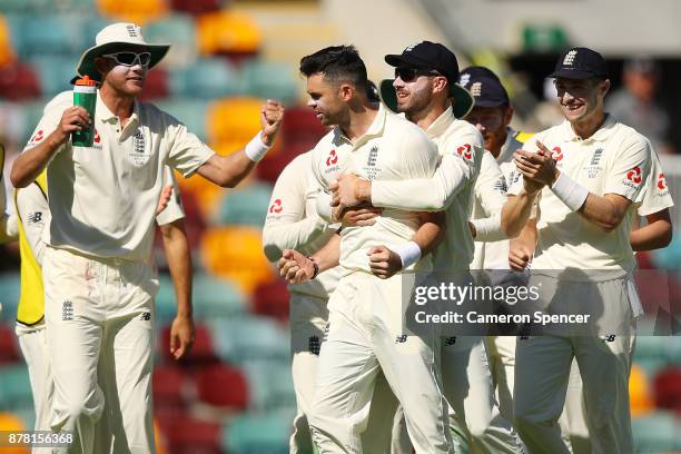 James Anderson of England celebrates with team mates after a successful DRS appeal for the dismissal of Peter Handscomb of Australia for lbw during...