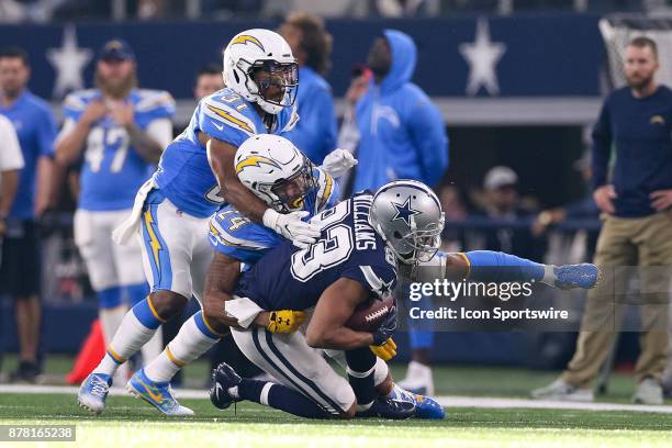 Dallas Cowboys wide receiver Terrance Williams makes a reception with Los Angeles Chargers cornerback Trevor Williams and safety Adrian Phillips...