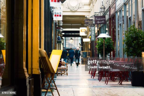 the passage verdeau. beautiful parisian shopping gallery - tourism drop in paris stock pictures, royalty-free photos & images