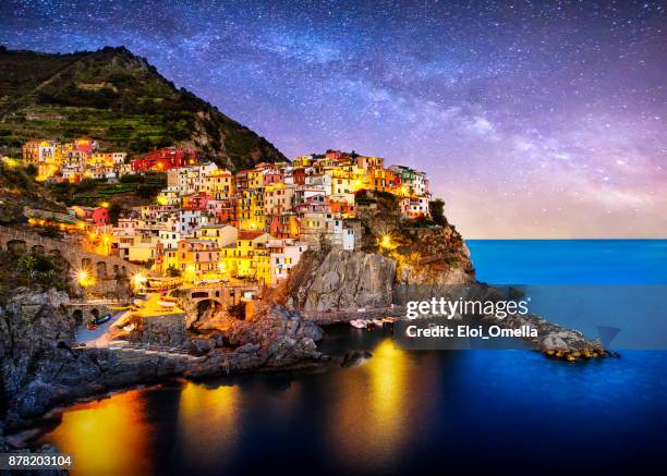 night blue hour manarola cinque terre liguria italy milky way - manarola stock pictures, royalty-free photos & images