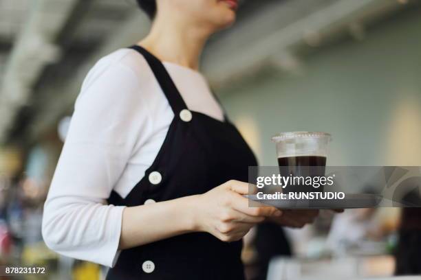 waitress holding tray and coffee at cafe - waitress bildbanksfoton och bilder